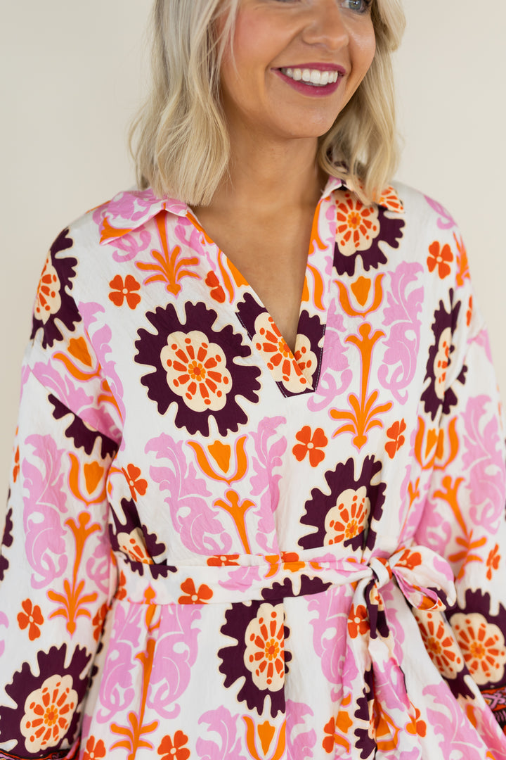Close-up of THML Marigold Bloom midi dress split neckline and floral print
