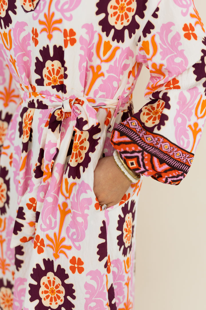 Close-up of balloon sleeve and floral print on THML Marigold Bloom midi dress