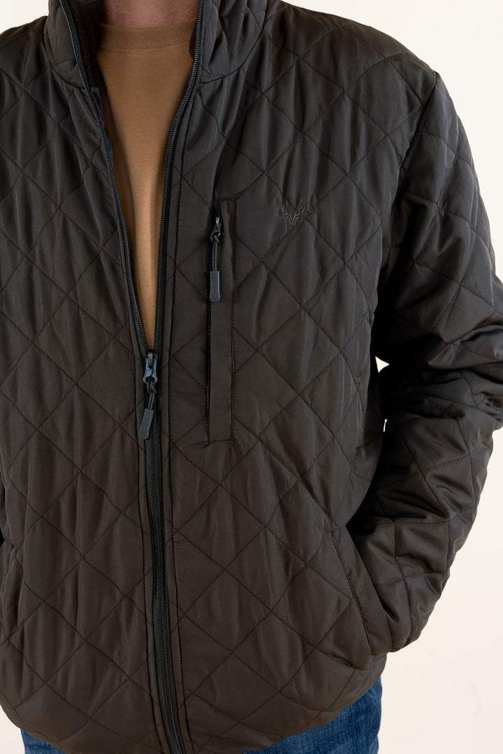 Close-up of the WILDGAME Gambler brown quilted jacket showing the diamond quilting, stand collar and front zipper.