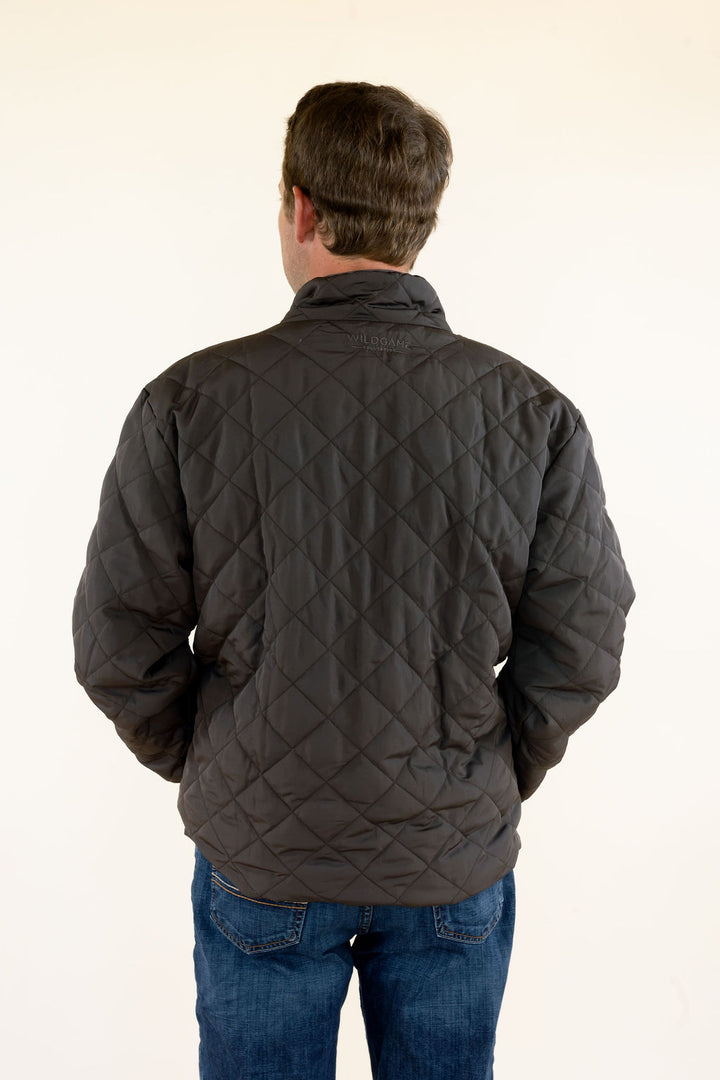 Back view of male model wearing the WILDGAME Gambler brown quilted jacket showing the diamond quilted pattern and fit.