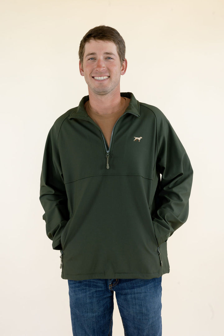 Front view of male model wearing the green Dogwood quarter zip pullover with zippered lower pockets.