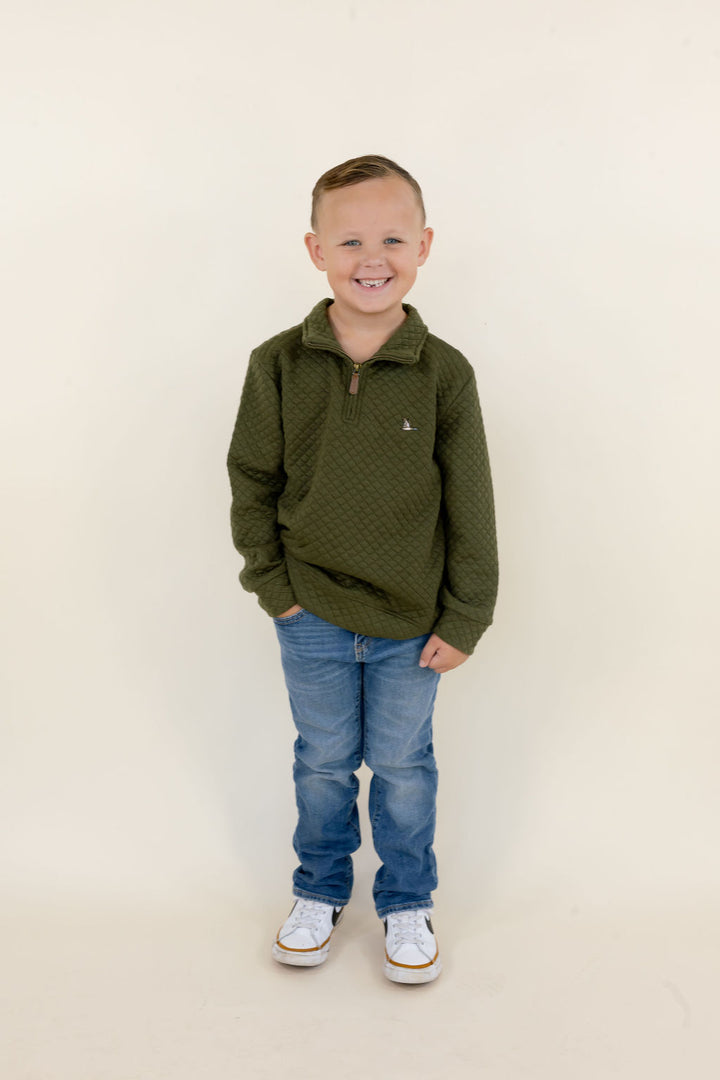 Youth model wearing the green Roost Drake quarter zip pullover with blue jeans, full-body front view.