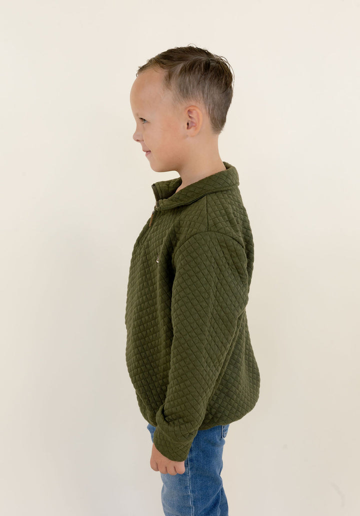 Side view of youth model wearing the green Roost Drake quarter zip pullover showing the fit and soft-shell construction.