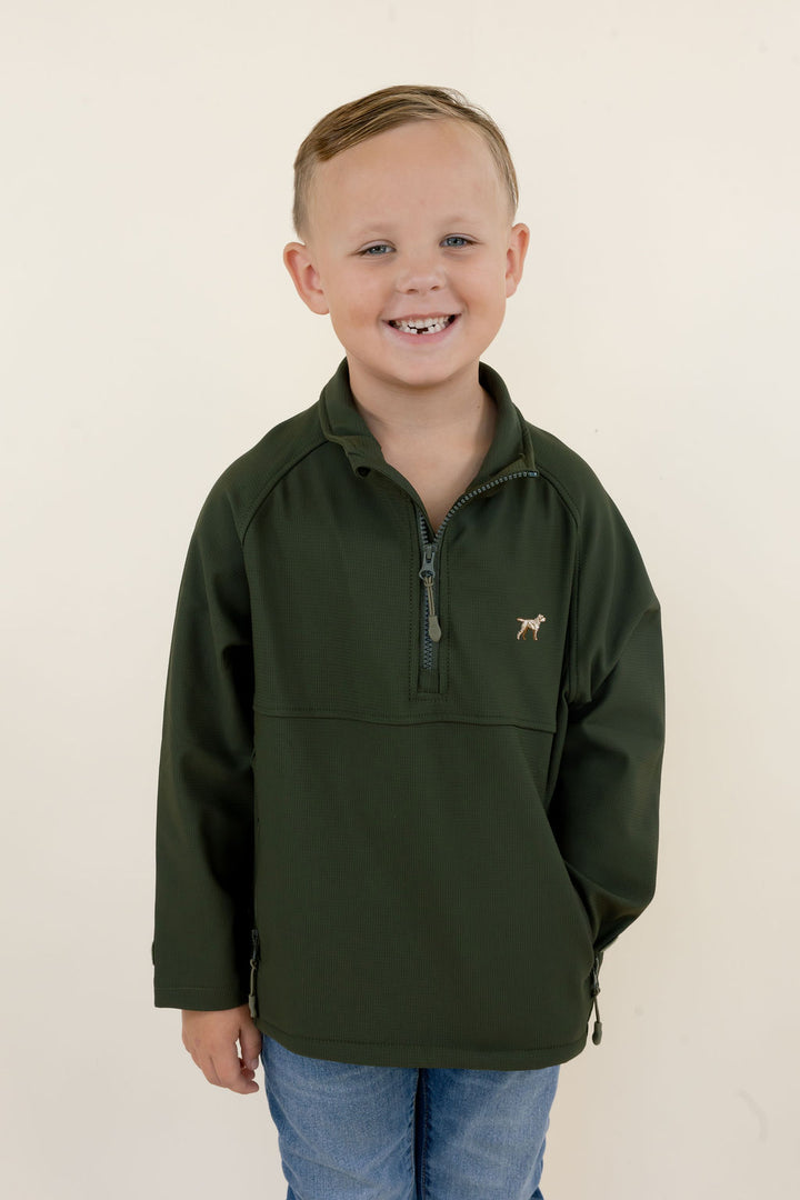 Youth model wearing the green Dogwood soft shell pullover showing the quarter-zip neckline, chest logo and relaxed fit.
