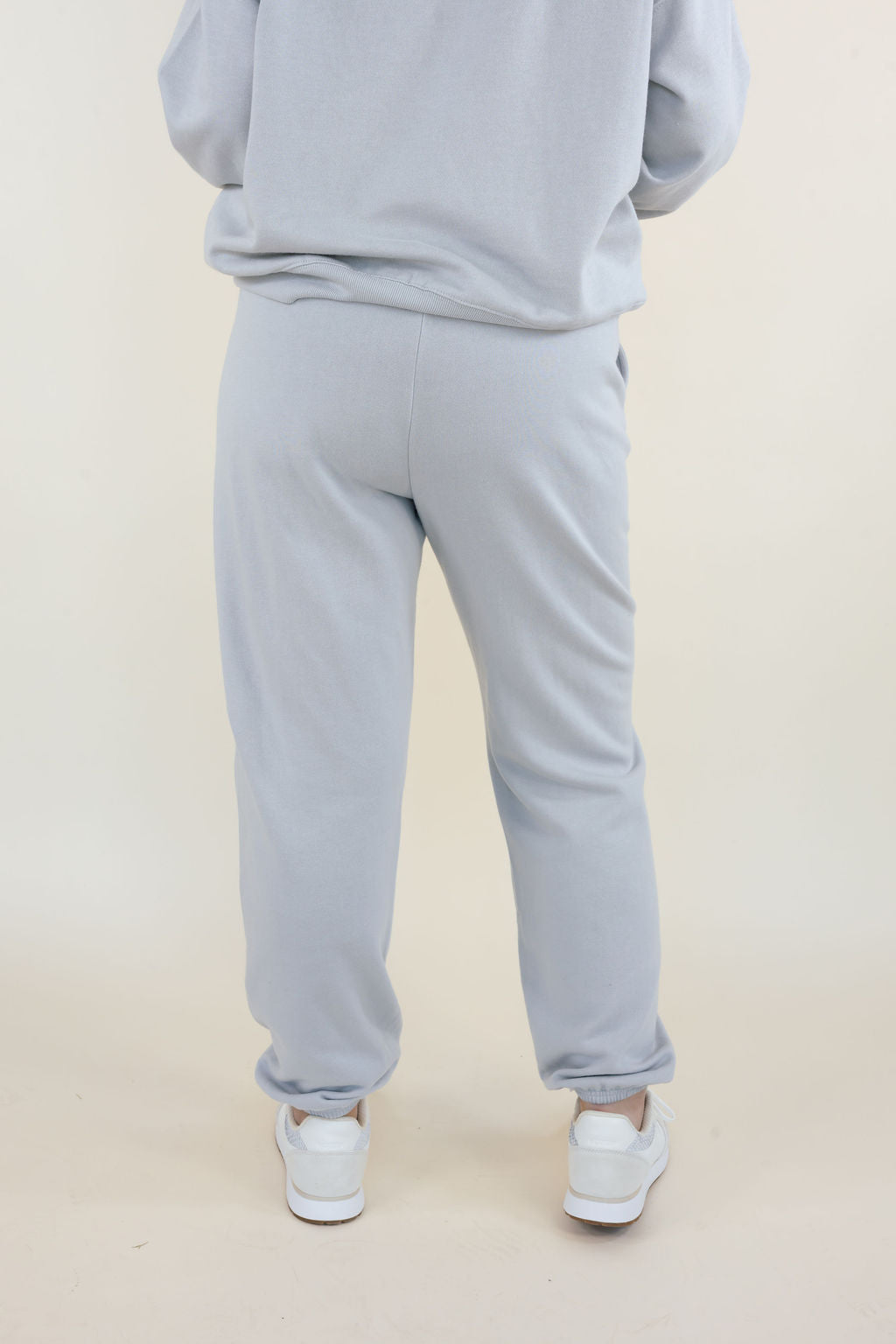 Back view of Uptown Classic Fleece Joggers in Silverlake showing relaxed fit through hips and legs with elastic ankle cuffs.