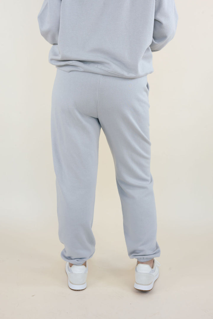 Back view of Uptown Classic Fleece Joggers in Silverlake showing relaxed fit through hips and legs with elastic ankle cuffs.