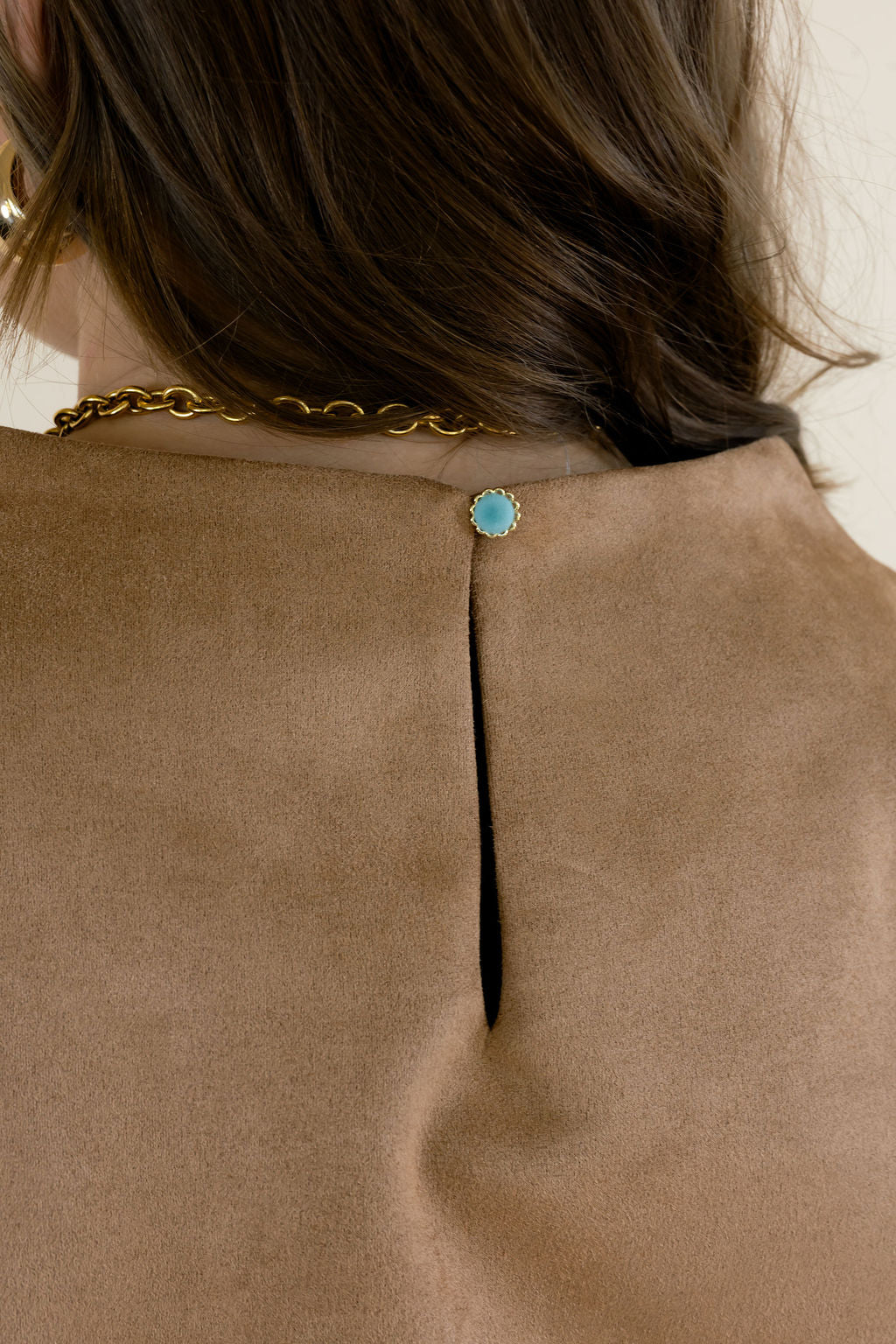 Close-up of brown faux suede women&