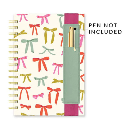 Bow print spiral notebook with built-in pen pocket, elastic band closure and lined pages, colorful planner journal gift from Square 1 Boutique Alabama