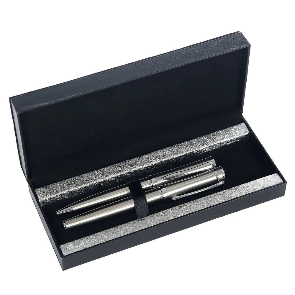 Set of silver pens in an open black box on a white background
