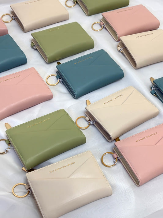 Luxe Pocket Keychain Wallet in misty blue, oat, sage, and blush vegan leather with gold key ring detail, slim compact card holder for everyday carry