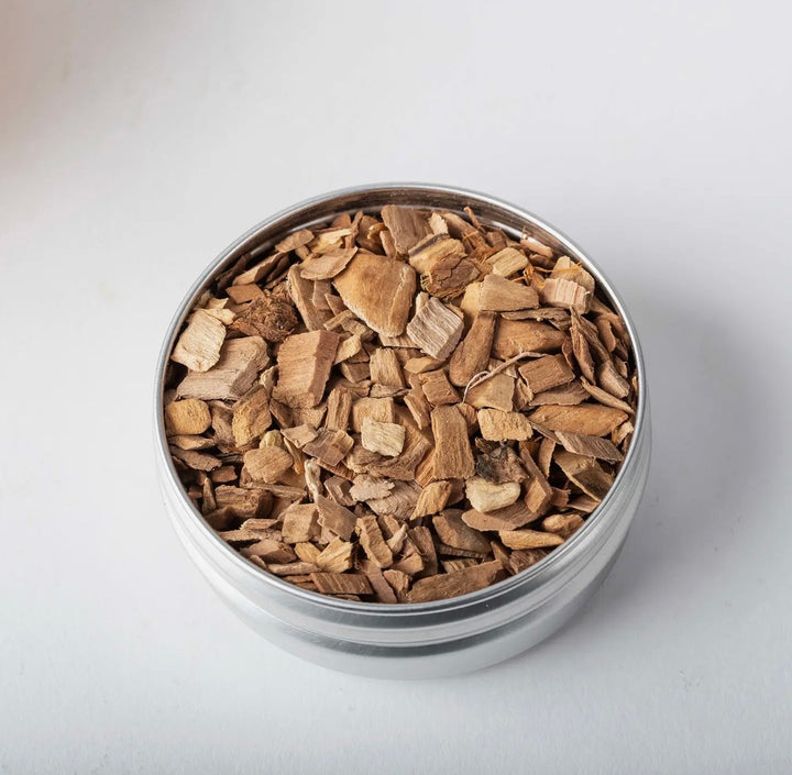 Close-up of natural cherry wood smoking chips for the Mad Man Whiskey Smoker cocktail infusion kit.