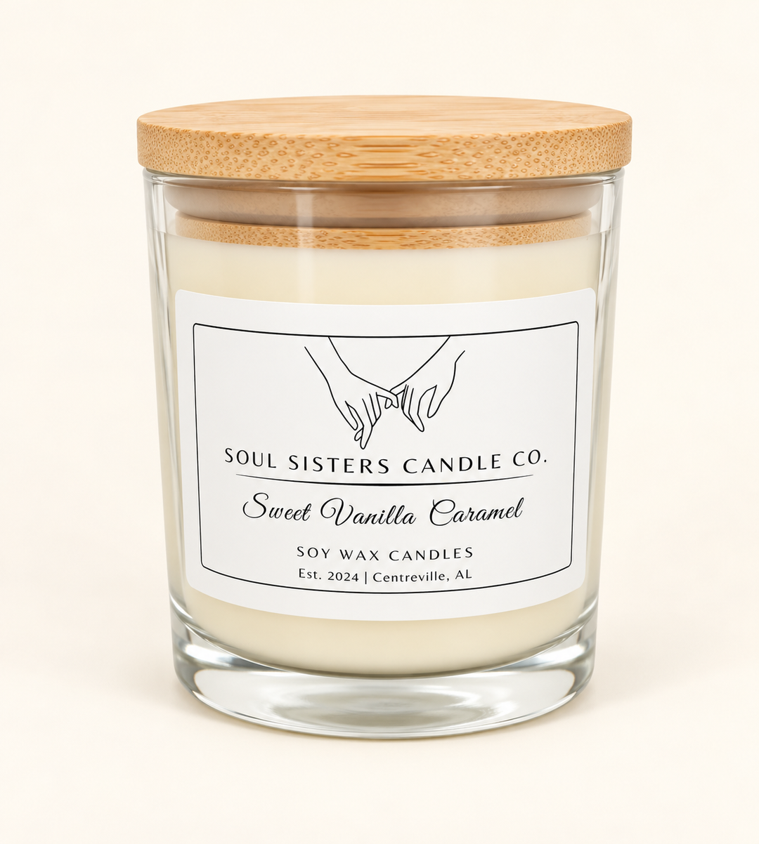 Soul Sisters Candle Co. Sweet Vanilla Caramel soy wax candle in a clear glass jar with natural wood lid, featuring caramel, brown sugar, and vanilla fragrance.