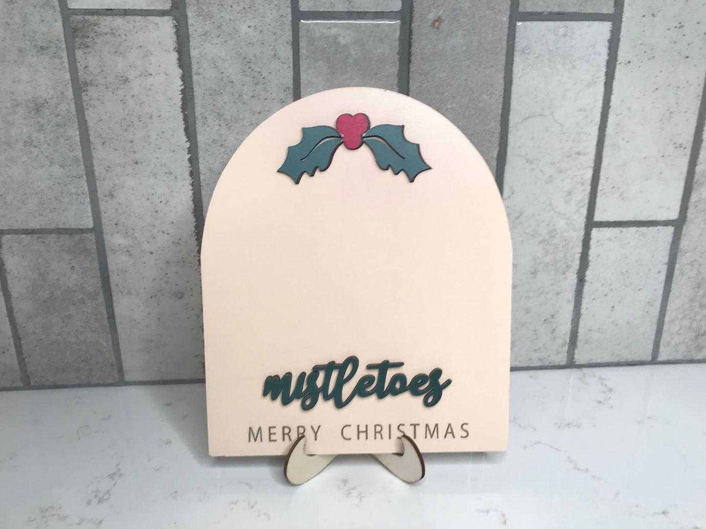 Neutral wood Mistletoes sign with holly detail and stand for baby first Christmas footprint