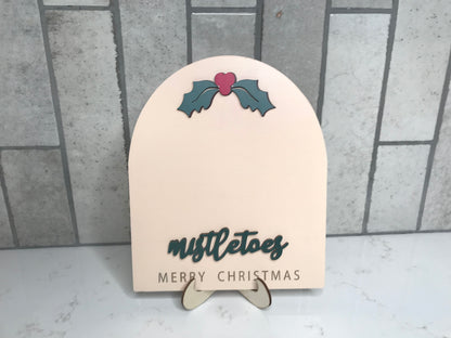 Neutral wood Mistletoes sign with holly detail and stand for baby first Christmas footprint