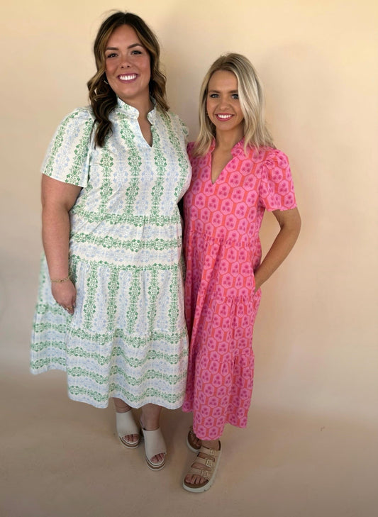 Two women modeling Ivy Maxi Dress in Rosette Charm Pink and Heirloom Vine Green floral prints with flutter sleeves and tiered midi skirt.