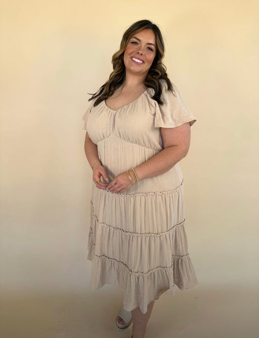 Keona V-Neck Gauze Dress in taupe with flutter sleeves and tiered midi skirt – angled front full-length view