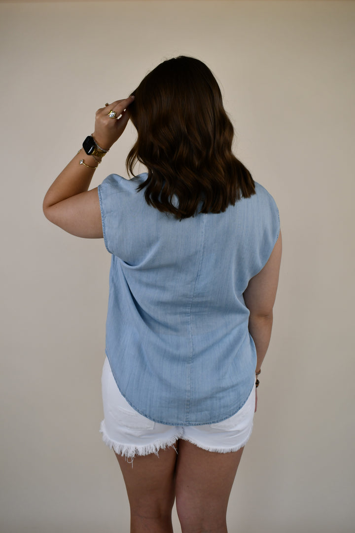 Back view of the Dear John Yanis V-Neck Cap Sleeve Top in Skyway Light Wash with a relaxed drape and cap sleeves.