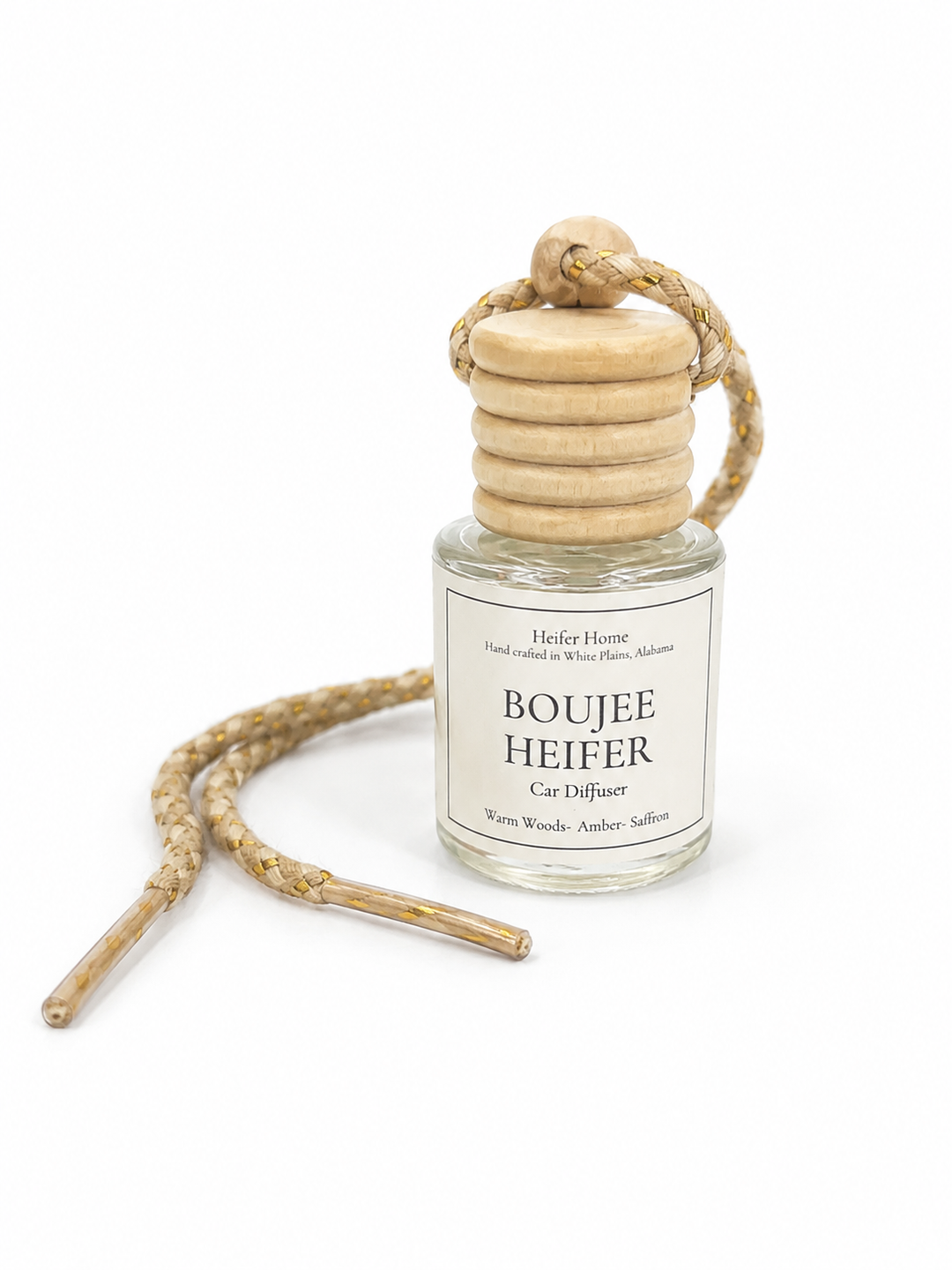 Heifer Home Boujee Heifer hanging car diffuser with natural wooden cap and braided cord featuring warm woods, amber, and saffron fragrance.