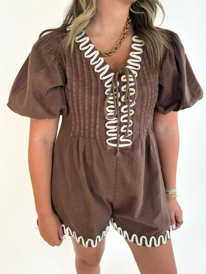 Close-up of the embroidered V-neckline on the women&