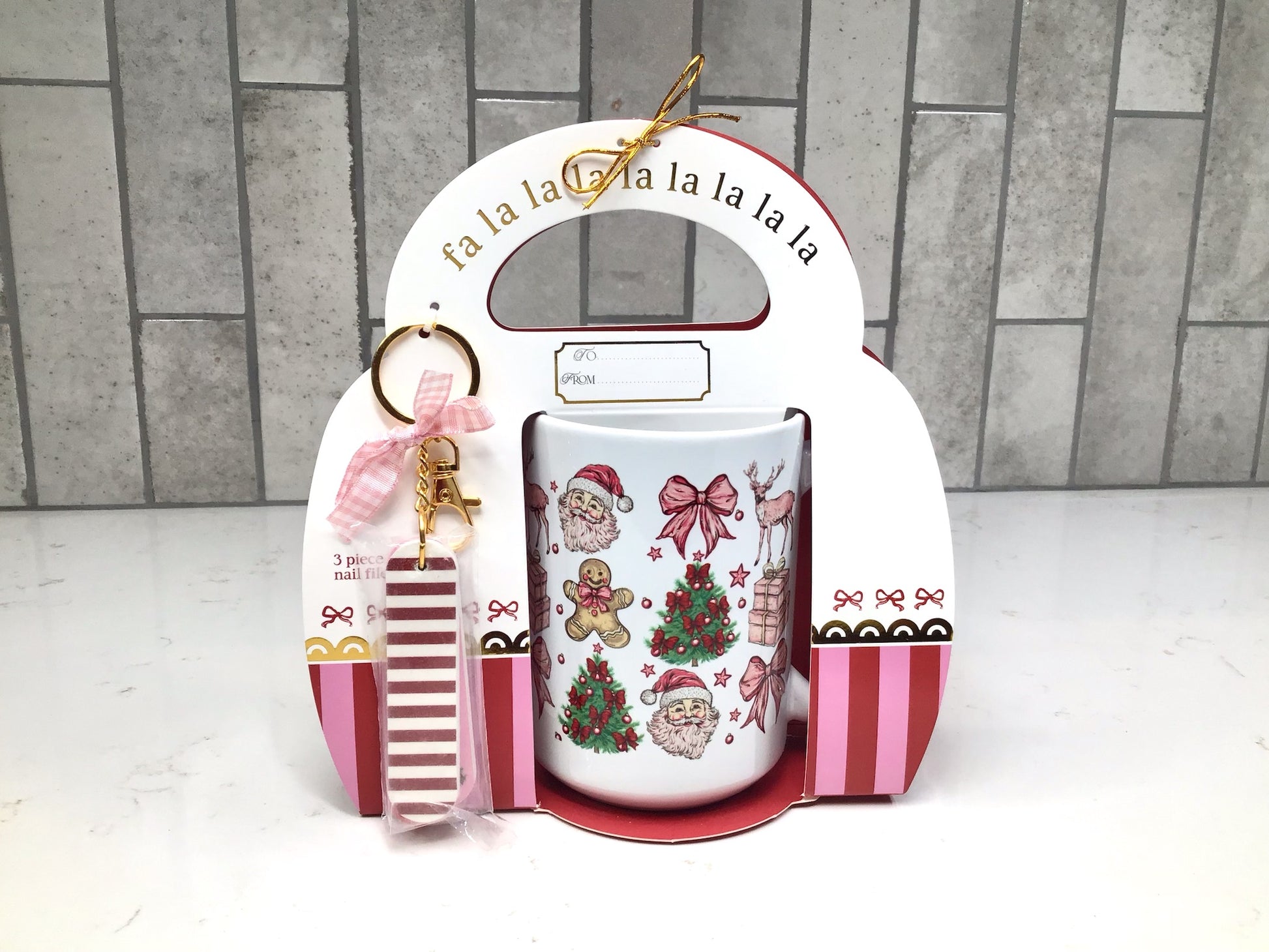 “Nutcracker-themed ceramic mug gift set with red and gold nutcracker artwork and matching nail file keychain.