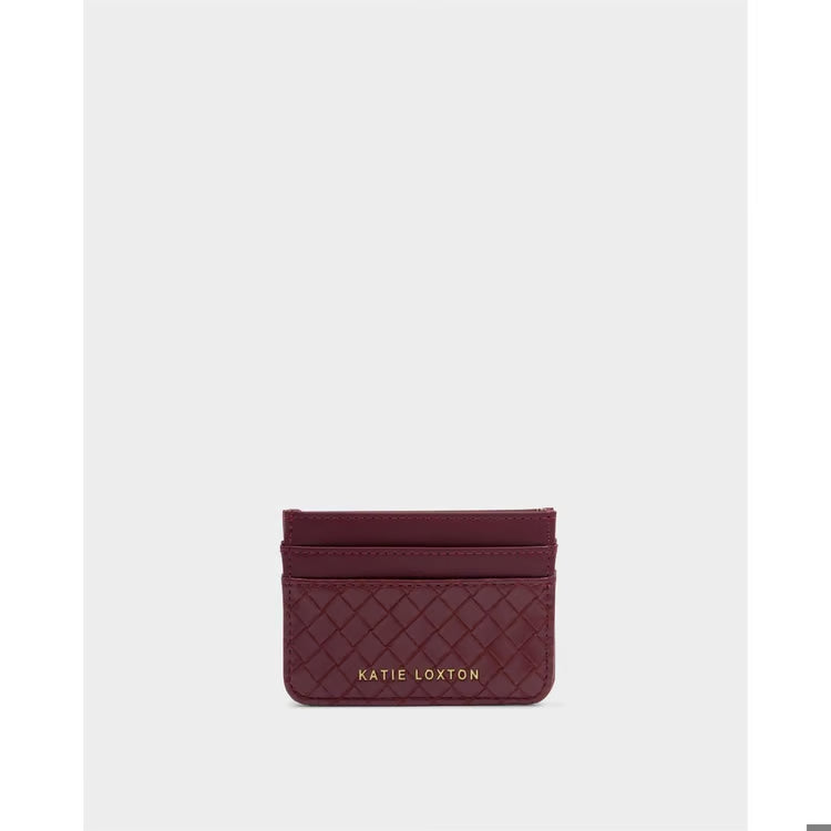 A small quilted leather card holder in deep burgundy with gold &