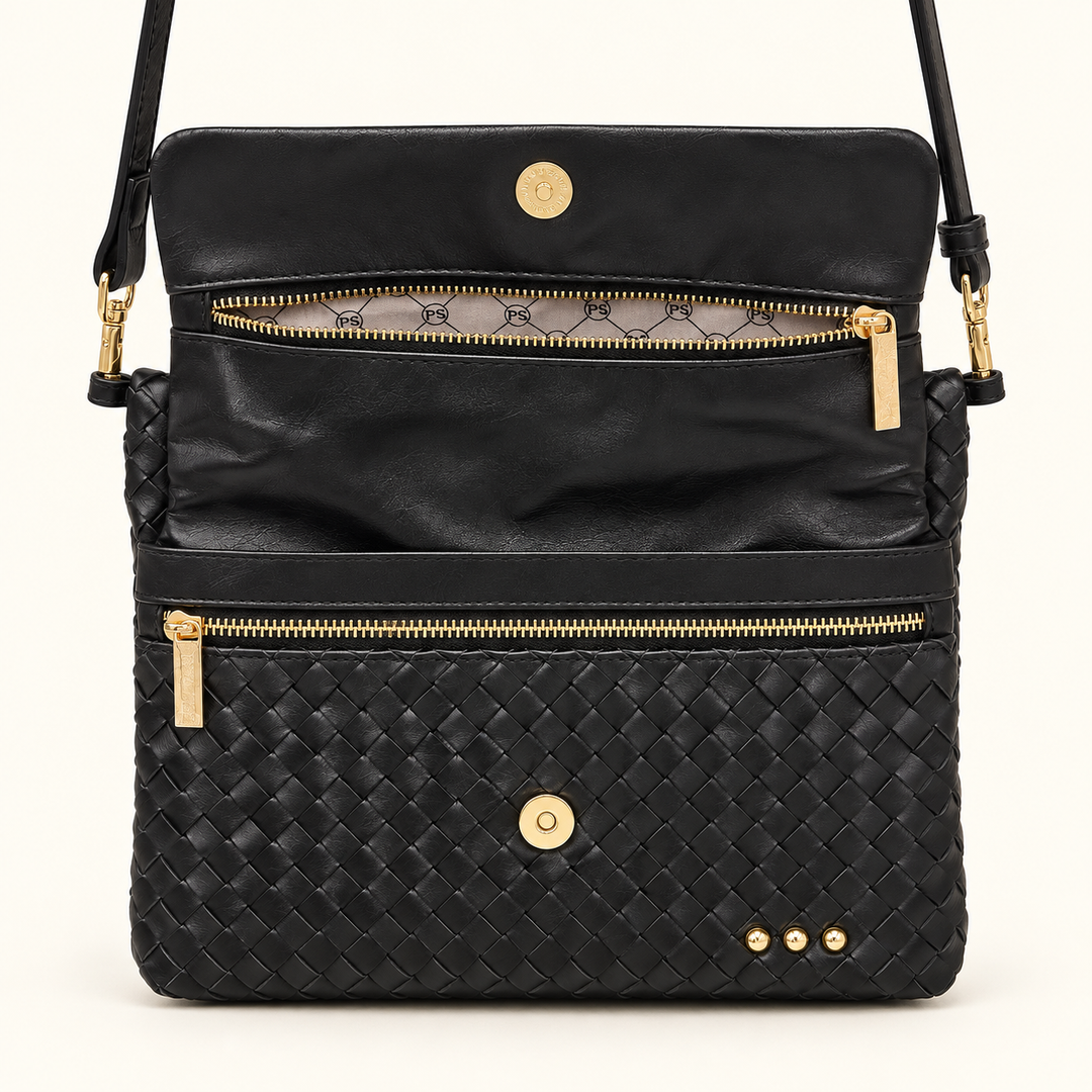Open Wrenlee Woven Flap Crossbody showing the interior compartments, zipper pockets, and gold-tone snap closure.