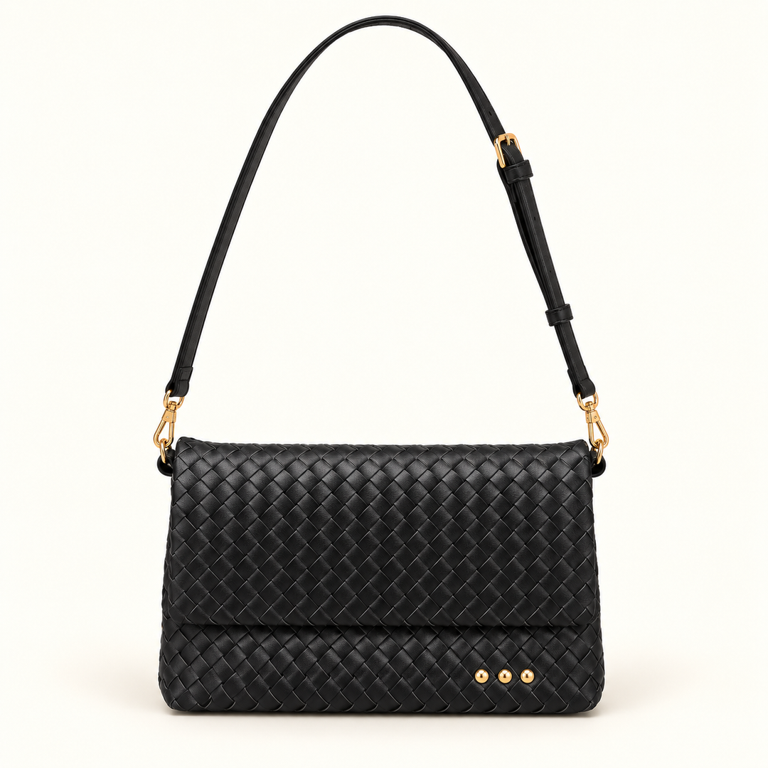 Front view of the Wrenlee Woven Flap Crossbody Bag in black with an adjustable strap and gold-tone hardware.