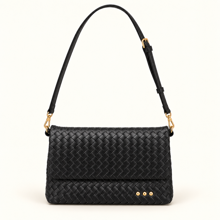Front view of the Wrenlee Woven Flap Crossbody Bag in black with an adjustable strap and gold-tone hardware.