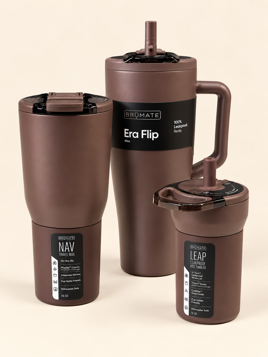 BrüMate insulated drinkware collection in matte brown featuring the 40oz Era Flip tumbler, 35oz NAV travel mug, and 12oz LEAP kids tumbler with coordinating lids on a cream studio background.