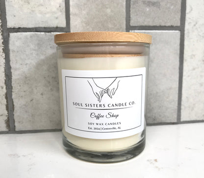 Scented candle with a wooden lid and 'Soul Sisters Candle Co.' label on a tiled wall background