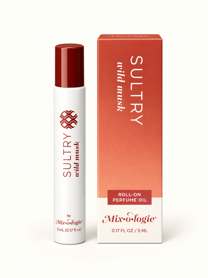Mixologie Sultry Wild Musk 5 mL rollerball perfume oil with burgundy cap and coral-peach gradient fragrance box on a cream background.