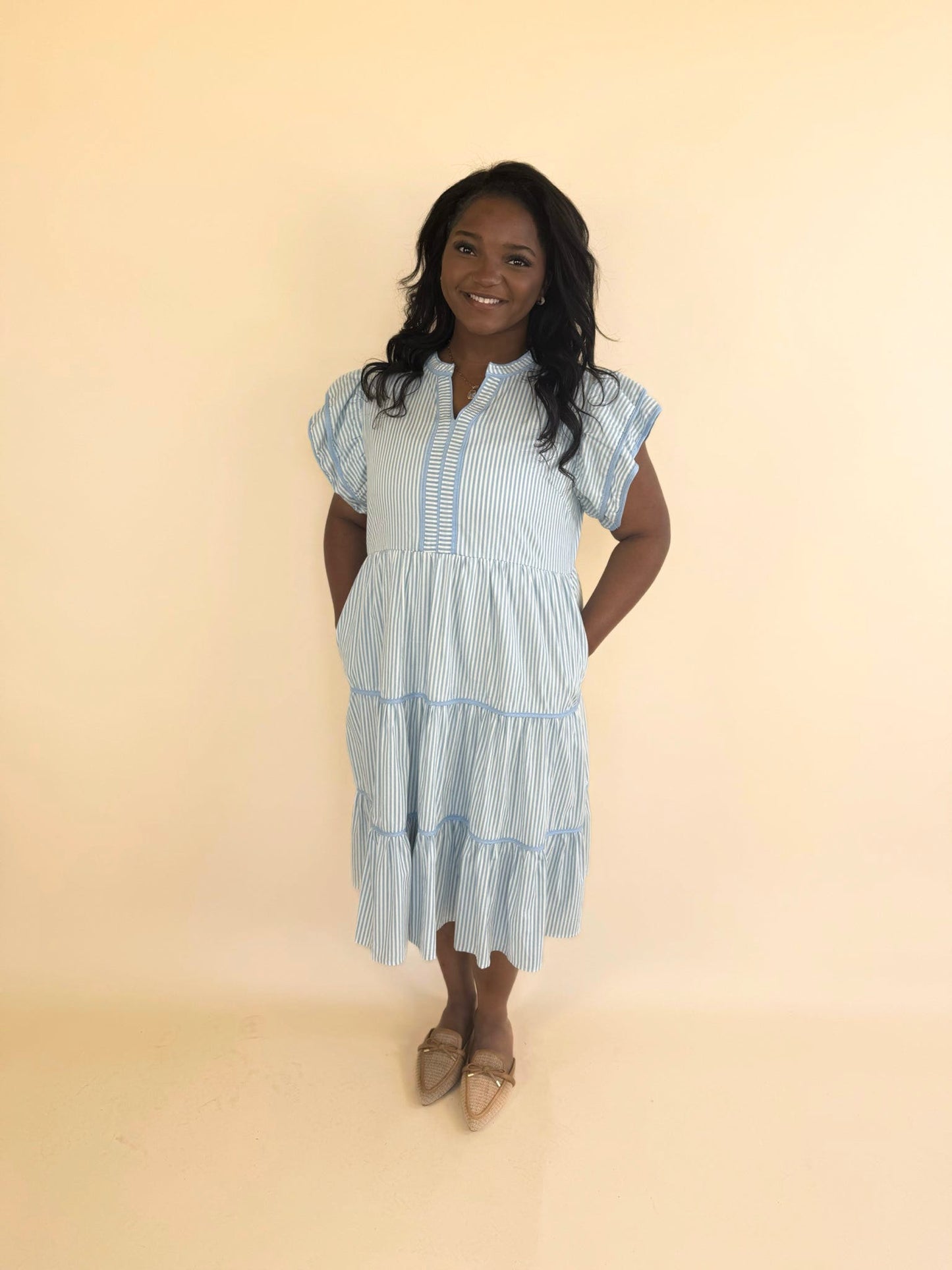Plus size blue pinstripe ruffle midi dress with pockets, flutter sleeves and flowy tiered skirt, spring and summer outfit