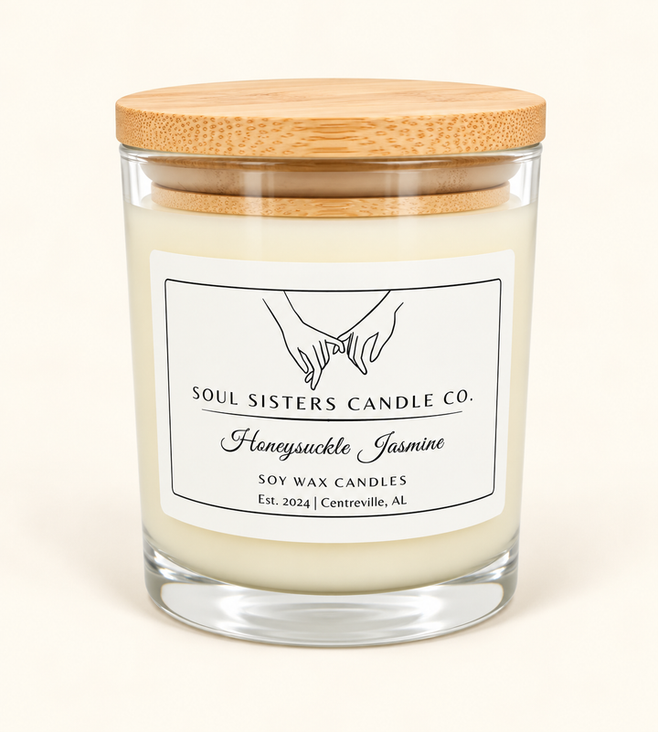 Soul Sisters Candle Co. Honeysuckle Jasmine soy wax candle featuring creamy ivory wax, clear glass jar, natural bamboo lid, and white branded label on a cream background.