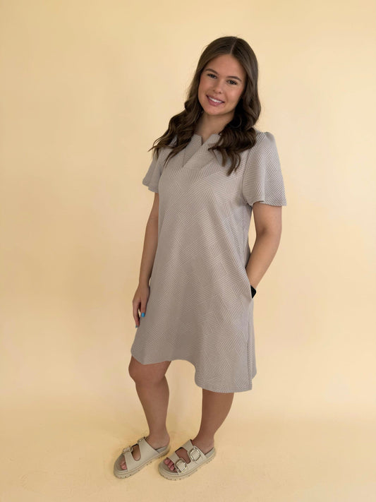 Arlette Collared Textured Dress in oatmeal with short sleeves, collared neckline and side pockets, shown on model wearing size medium