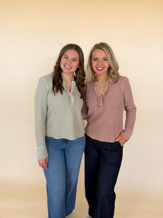 Two women modeling Dear John Luna thermal tops in Abbey stone and pink clay with dark denim jeans.