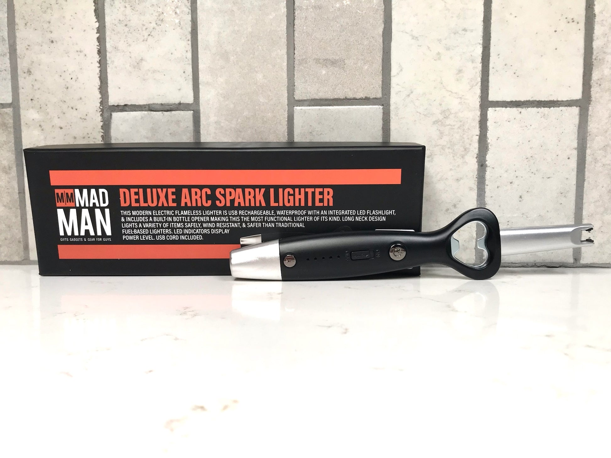 Deluxe arc spark lighter with packaging on a white surface