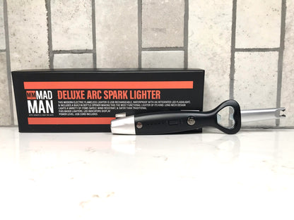 Deluxe arc spark lighter with packaging on a white surface
