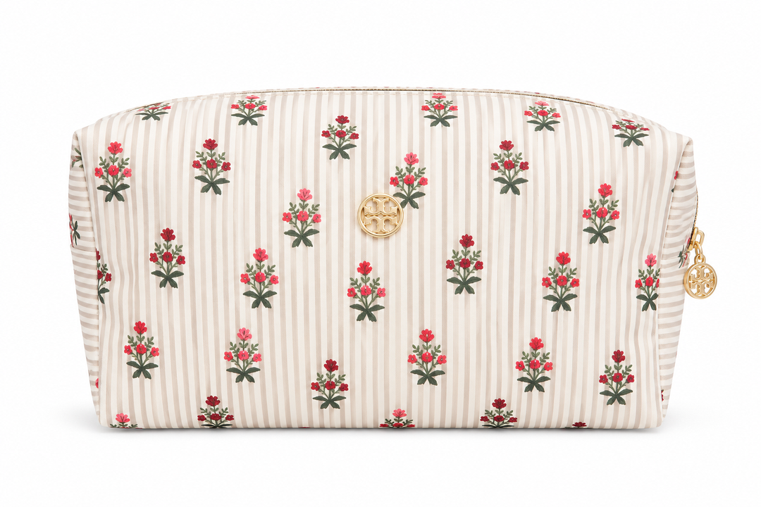 Beige striped cosmetic bag with pink floral print, gold emblem, and zip closure, spacious travel makeup pouch for cosmetics, skincare, toiletries, and everyday beauty essentials.