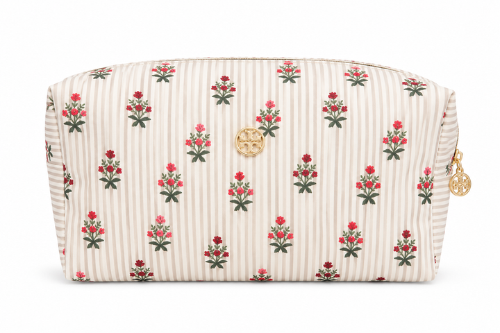 Beige striped cosmetic bag with pink floral print, gold emblem, and zip closure, spacious travel makeup pouch for cosmetics, skincare, toiletries, and everyday beauty essentials.