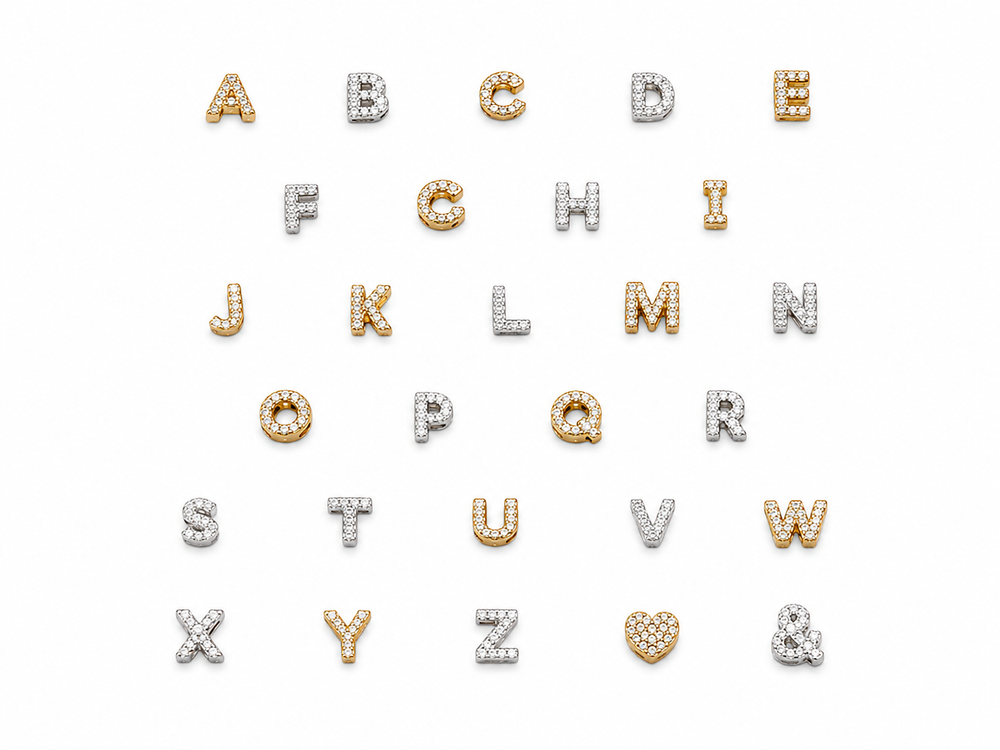 An alphabet jewelry set featuring the English alphabet from A to Z and the ampersand (&) arranged in rows on a plain white background. The letters are crafted in yellow gold and white gold, heavily embellished with small round-cut clear gemstones that create a sparkling effect.