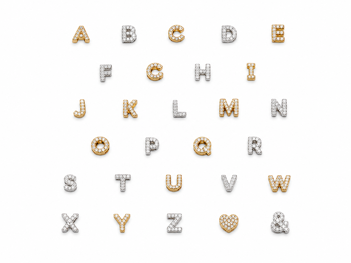 An alphabet jewelry set featuring the English alphabet from A to Z and the ampersand (&amp;) arranged in rows on a plain white background. The letters are crafted in yellow gold and white gold, heavily embellished with small round-cut clear gemstones that create a sparkling effect.