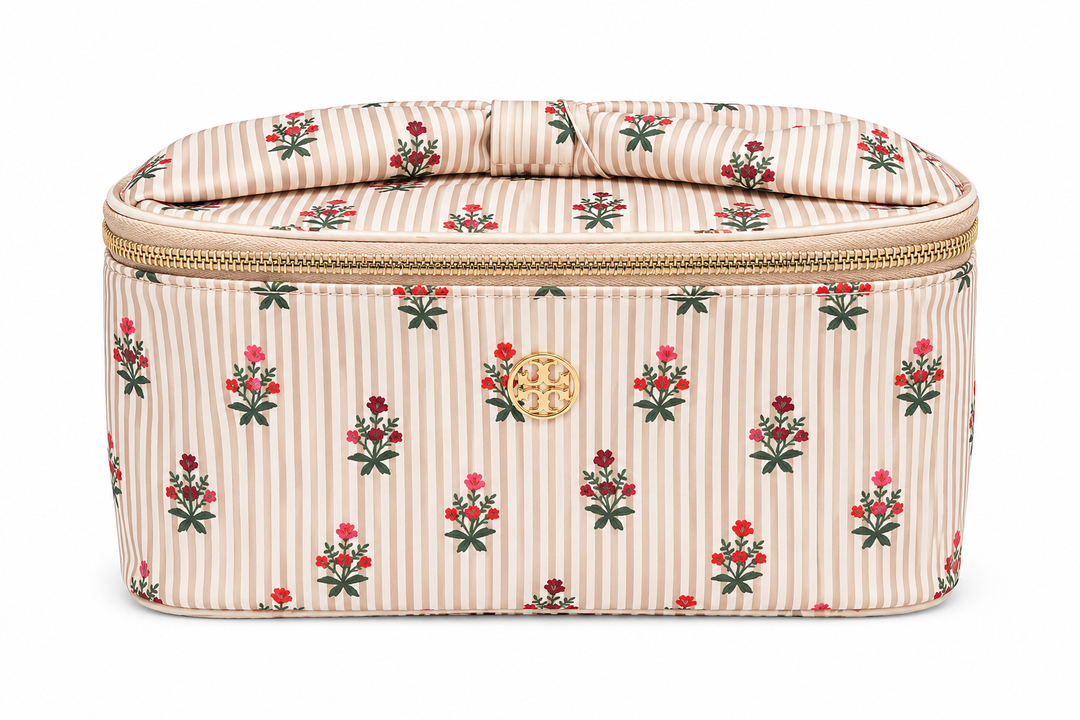 Beige striped floral travel cosmetic case with red flower print, top carry handle, gold zipper, and spacious makeup storage for travel and everyday organization.