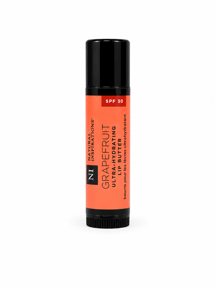 Natural Inspirations Grapefruit Ultra-Hydrating Lip Butter with SPF 30 in a moisturizing lip balm tube for nourishing lip care.