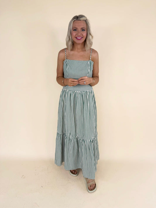 Jolene thin striped dress in green and ivory with adjustable spaghetti straps and tiered maxi skirt.