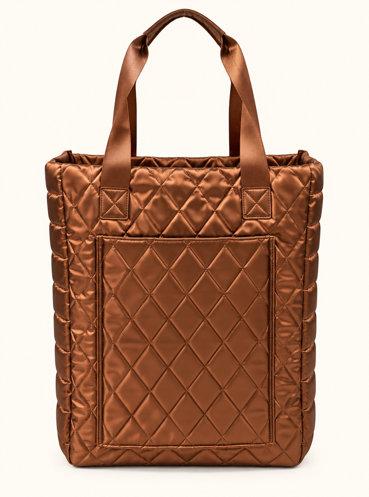 Rear view of Simply Southern copper quilted tote bag featuring sturdy shoulder straps, metallic diamond stitching, and large exterior back pocket.