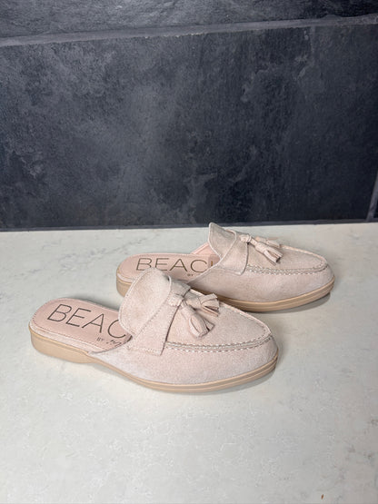 Pair of beige loafers with 'BEAC' branding on a light gray surface.