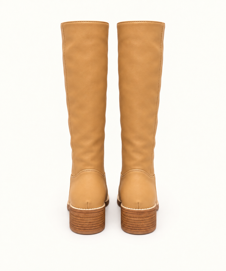 Rear view of Corkys Put Up or Shut Up camel knee-high boots featuring stitched shafts and block heels.