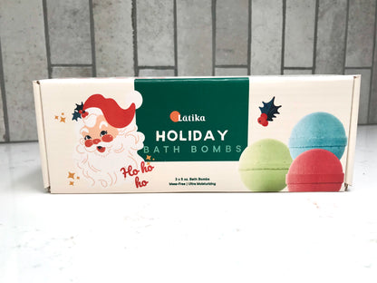 Box of Latika Holiday Bath Bombs with colorful bath bombs on a white surface.