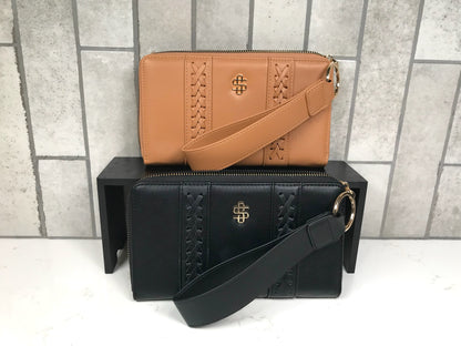 Brown and black handbags with a shared brand logo on a tiled background