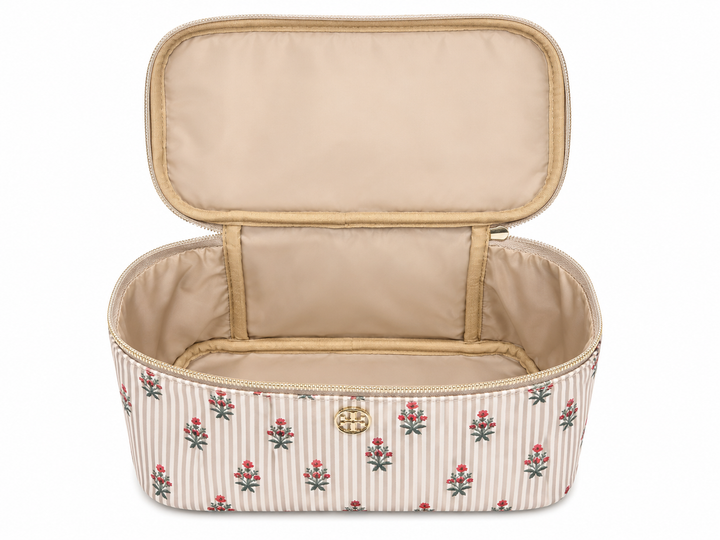 Open beige striped floral cosmetic travel case with roomy interior, structured design, and wide zip opening for organizing makeup, skincare, toiletries, and beauty essentials.